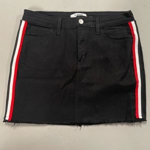 O2 black denim skirt with white and red stripes down the side